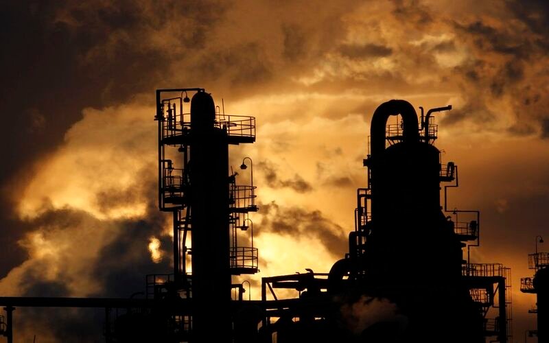 Oil mixed amid macroeconomic concerns but set to end quarter up 30% Steam is emitted from an oil refinery in Yokohama