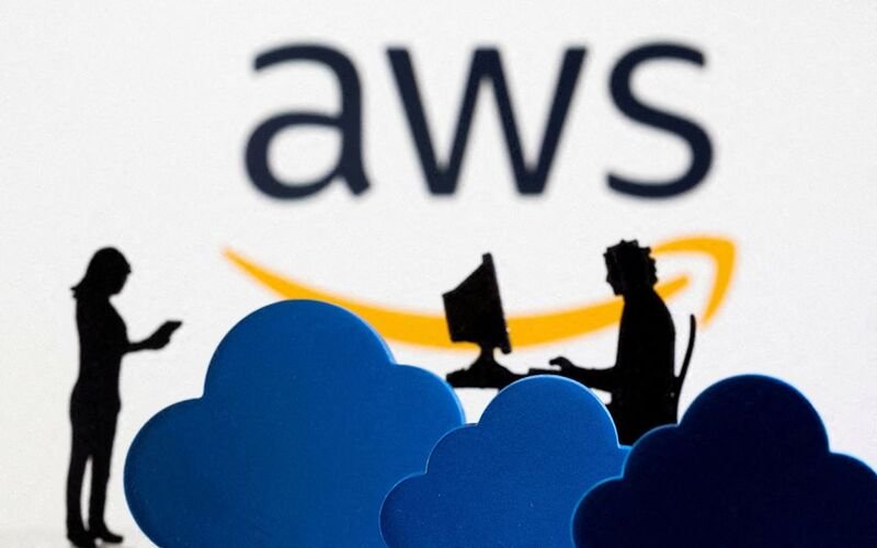 3D printed clouds and figurines are seen in front of the AWS (Amazon Web Service) cloud service logo in this illustration taken February 8, 2022. REUTERS/Dado Ruvic/Illustration//File Photo