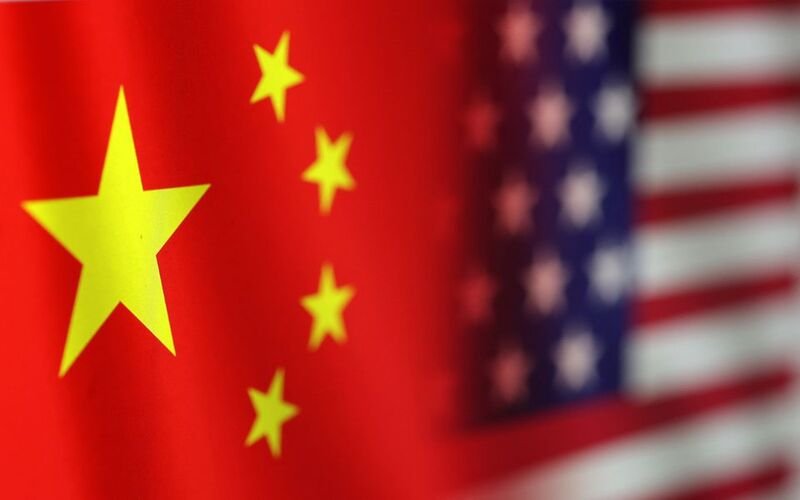 U.S. and Chinese flags are seen in this illustration taken, January 30, 2023. REUTERS/Dado Ruvic/Illustration