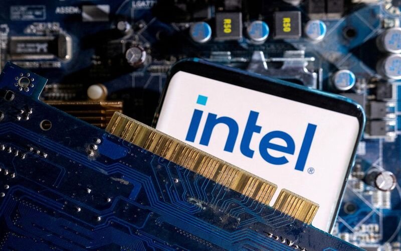 Germany rejecting Intel’s chip factory subsidies. A smartphone with a displayed Intel logo is placed on a computer motherboard in this illustration taken March 6, 2023. REUTERS/Dado Ruvic/Illustration/