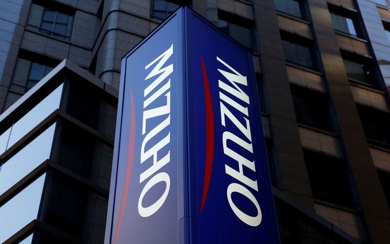 Mizuho Bank's signboard is pictured in Tokyo, Japan