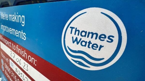 Signage is seen for British utility company Thames Water at a repair site in London, Britain