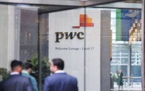 PwC logo is seen in the lobby of their offices in Barangaroo, Australia, June 22, 2023. REUTERS/Lewis Jackson/File Photo