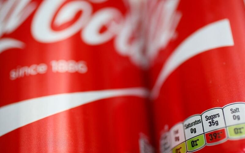 Coca-Cola lifts forecasts on higher prices and steady demand A detail of a can of Coca-Cola is seen in London, Britain March 16, 2016. REUTERS/Stefan Wermuth/File Photo