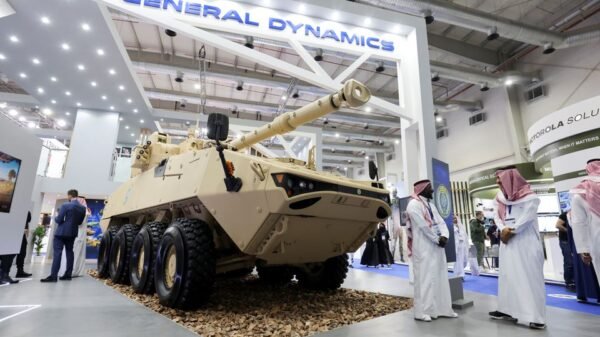 Saudi men are seen at General Dynamics stand displaying the latest defence system at World Defense Show in Riyadh, Saudi Arabia, March 6, 2022. REUTERS/Ahmed Yosri/File Photo