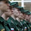 Russian conscripts called up for military service line up before their departure for garrisons as they gather at a recruitment centre in Simferopol, Crimea, April 25, 2023. REUTERS/Alexey Pavlishak/File Photo