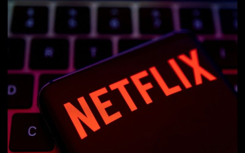 Netflix shares jump as results show resilience despite Hollywood strikes Smartphone with Netflix logo is placed on a keyboard in this illustration taken April 19, 2022. REUTERS/Dado Ruvic/File Photo