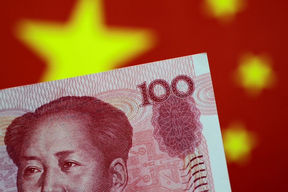 China regulators probe liquidity stress that sent rates to record 50% A China yuan note is seen in this illustration photo May 31, 2017. REUTERS/Thomas White/Illustration/File Photo