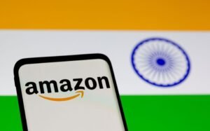 Smartphone with Amazon logo is seen in front of displayed Indian flag in this illustration taken, July 30, 2021. REUTERS/Dado Ruvic/Illustration/File Photo