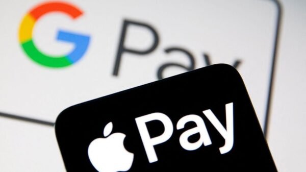 A smartphone with the Apple Pay logo is placed on a displayed Google Pay logo in this illustration taken on July 14, 2021. REUTERS/Dado Ruvic/Illustratio
