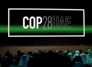 Cop28 UAE' logo is displayed on the screen during the opening ceremony of Abu Dhabi Sustainability Week (ADSW) under the theme of 'United on Climate Action Toward COP28', in Abu Dhabi, UAE, January 16, 2023. REUTERS/Rula Rouhana/File Photo