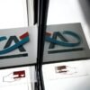 A Credit Agricole logo?is reflected in a window of a bank office in Nantes, France, May 10, 2023. REUTERS/Stephane Mahe/File Photo