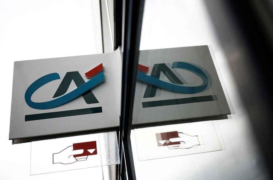 Credit Agricole beats forecasts on strong investment bank boost A Credit Agricole logo?is reflected in a window of a bank office in Nantes, France, May 10, 2023. REUTERS/Stephane Mahe/File Photo