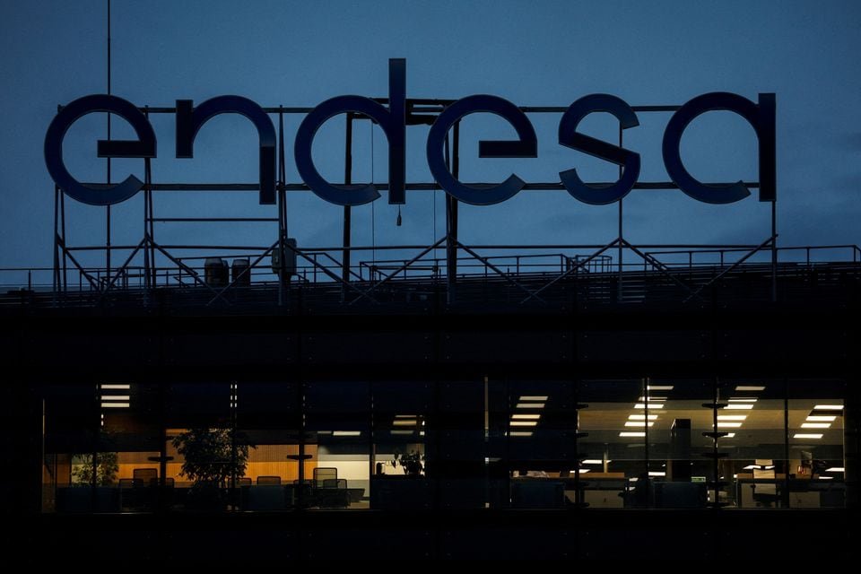Spain’s Endesa cuts profit outlook as it unveils 8.9 bln euros investment plan The logo of Spanish power company Endesa tops it headquarters in Madrid, Spain, April 27, 2022. REUTERS/Susana Vera/File Photo