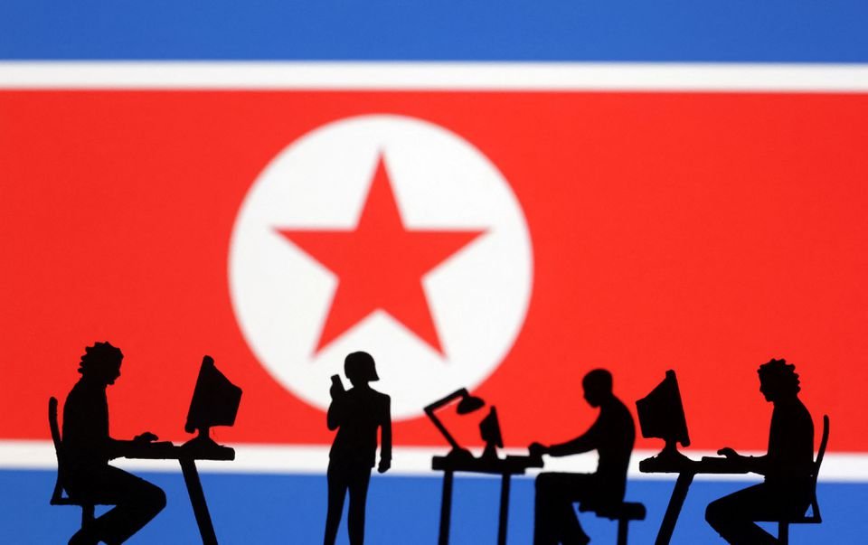 US, South Korea, and Japan to launch consultative group on North’s cyber threats Miniatures of people with computers are seen in front of North Korea flag in this illustration taken July 19, 2023. REUTERS/Dado Ruvic/Illustration/File Photo