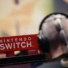 An attendee uses a Nintendo Switch game console while playing a video game at the Paris Games Week (PGW), a trade fair for video games in Paris, France, November 5, 2023. REUTERS/Claudia Greco/File Photo