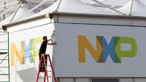 A man works on a tent for NXP Semiconductors in preparation for the 2015 International Consumer Electronics Show (CES) at Las Vegas Convention Center in Las Vegas, Nevada, U.S. on January 4, 2015. REUTERS/Steve Marcus/File Photo