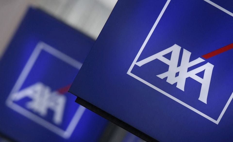 AXA explores $1.1 bln disposal of European protection businesses -sources Signs displaying the logo of French insurer AXA on a building in Nanterre, near Paris, March 8, 2016. REUTERS/Christian Hartmann/File Photo
