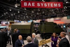 People gather at the BAE Systems' booth during the Association of the United States Army (AUSA) Global Force Symposium & Exposition in Huntsville, Alabama, U.S. March 28, 2023. REUTERS/Cheney Orr/File Photo