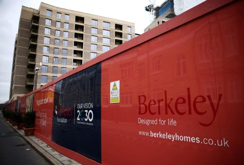 UK’s Berkeley flags subdued demand in housing market Hoardings display a logo of Berkeley Group outside a development in London, Britain, March 4, 2023. REUTERS/Henry Nicholls/File Photo