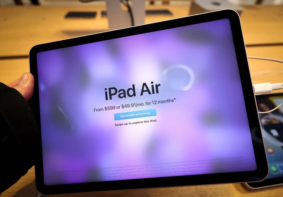 The new Apple iPad Air tablet is displayed shortly after it went on sale at the Apple Store on 5th Avenue in Manhattan, in New York City, New York, U.S., March 18, 2022. REUTERS/Mike Segar/File Photo