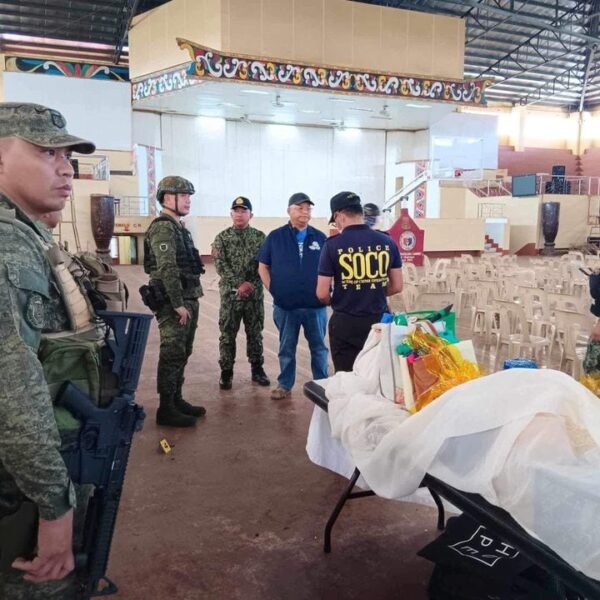Lanao Del Sur Governor Mamintal Adiong Jr. stands among law enforcement officers as they investigate the scene of an explosion that occurred during a Catholic Mass in a gymnasium at Mindanao State University in Marawi, Philippines, December 3, 2023. Lanao Del Sur Provincial Government/Handout via REUTERS