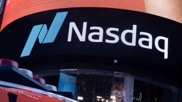 The Nasdaq logo is displayed at the Nasdaq Market site in Times Square in New York City, U.S., December 3, 2021. REUTERS/Jeenah Moon/File Photo