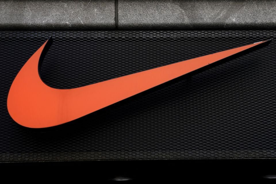 Nike forecast cut rattles sportswear stocks as spending stumbles The Nike swoosh logo is pictured on a store in New York City, New York, U.S., September 4, 2018. REUTERS/Carlo Allegri/File Photo