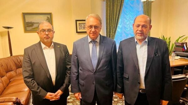 Senior Hamas officials Bassem Naim and Moussa Abu Marzouk, and Russia's Deputy Foreign Minister Mikhail Bogdanov meet for talks on the release of foreign hostages, at a location given as Moscow, Russia in this handout image released on October 26, 2023. Hamas Handout/Handout via REUTERS/File Photo