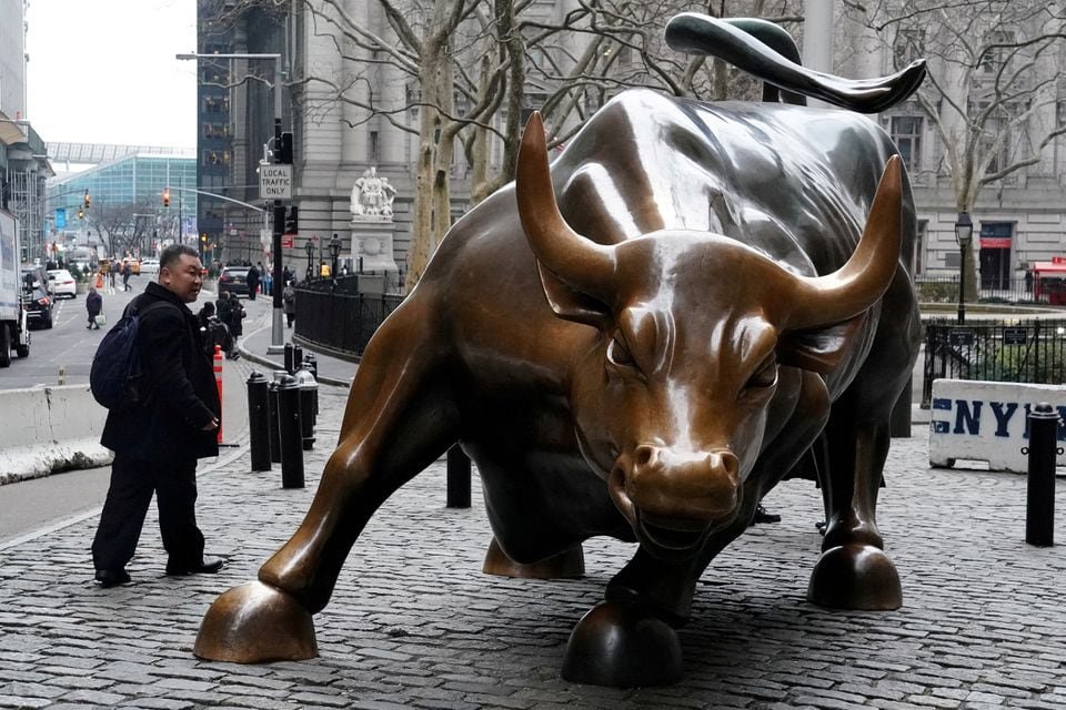 Investors cheer Fed’s dovish pivot, as focus shifts to 2024 risks The Charging Bull or Wall Street Bull is pictured in the Manhattan borough of New York City, New York, U.S., January 16, 2019. REUTERS/Carlo Allegri/File Photo