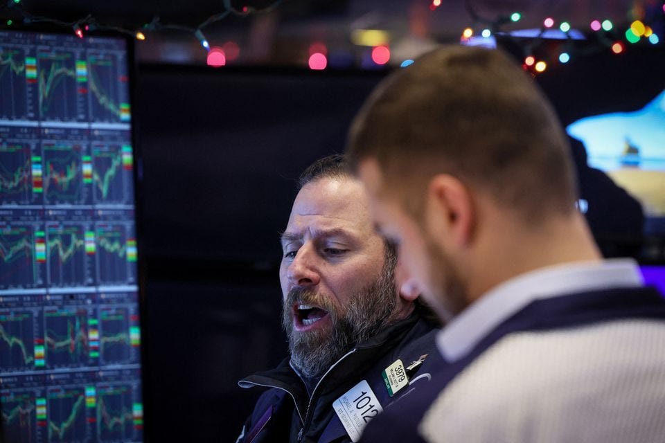 Wall Street closes at fresh 2023 highs as inflation data, Fed eyed Traders work on the floor at the New York Stock Exchange (NYSE) in New York City, U.S., December 11, 2023. REUTERS/Brendan McDermid