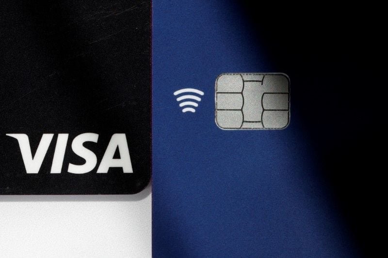 The UK payments regulator proposes a cap on Mastercard and Visa cross-border fees Visa credit and debit cards are seen in this picture illustration taken August 2, 2022. REUTERS/Benoit Tessier/File Photo