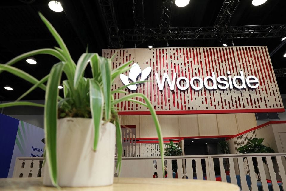 Australia’s Woodside Energy signs 20-year LNG deal with Mexico Pacific A plant decorates the booth of Australian petroleum exploration and production company Woodside Energy during the LNG 2023 energy trade show in Vancouver, British Columbia, Canada, July 13, 2023. REUTERS/Chris Helgren