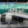 A worker walks past Boeing's new 737 MAX-9 under construction at their production facility in Renton, Washington, U.S., February 13, 2017. Picture taken February 13, 2017. REUTERS/Jason Redmond/File Photo
