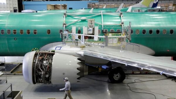 A worker walks past Boeing's new 737 MAX-9 under construction at their production facility in Renton, Washington, U.S., February 13, 2017. Picture taken February 13, 2017. REUTERS/Jason Redmond/File Photo