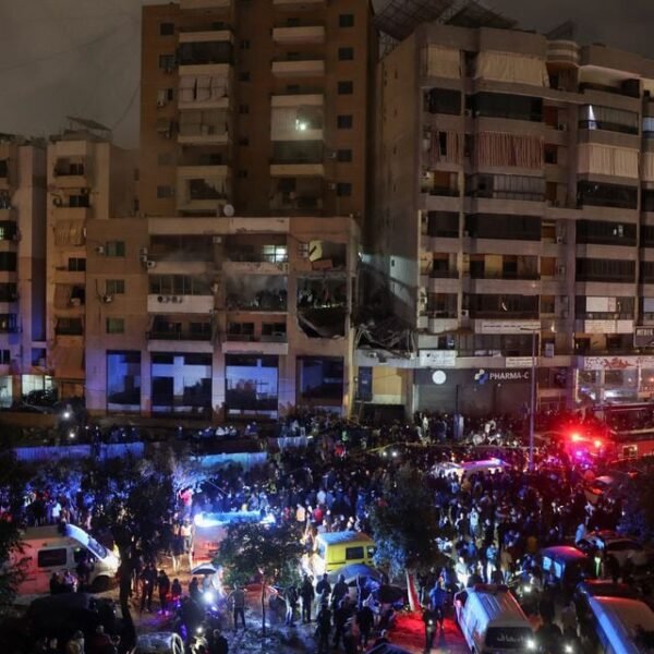 People gather near a damaged site following an explosion at the Beirut suburb of Dahiyeh, Lebanon January 2, 2024. REUTERS/Mohamed Azakir