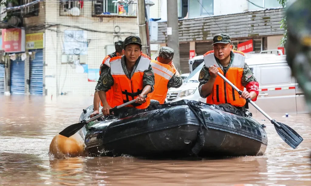 China Flood Crisis: Tens of Thousands Flee Rising Waters in Massive Evacuation Efforts China Flood Crisis: Tens of Thousands Flee Rising Waters