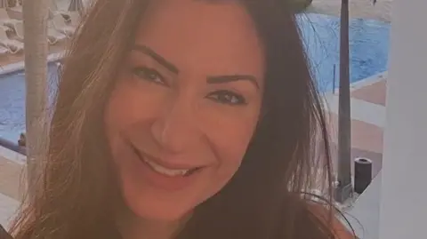 Handout Andria Rose is seen with a swimming pool behind her