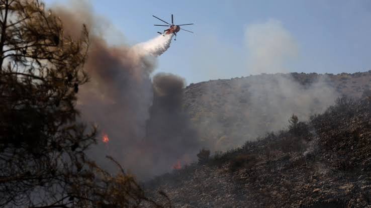 Two dead and hundreds evacuated after twin fires break out on Greek island
