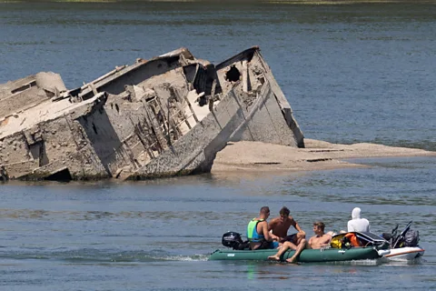 Reuters/ Djordje Kojadinovi The exposed German warships were scuttled near Prahovo in 1944 and many still contain ammunition and explosives (Credit: Reuters/ Djordje Kojadinovi)