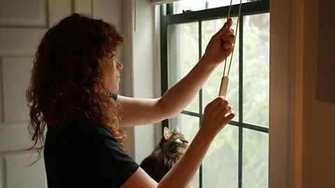 Ally Hirschlag To support my new sleep routine, researchers suggested I use blackout blinds, but also to open them first thing in the morning to let in the morning light (Credit: Ally Hirschlag)